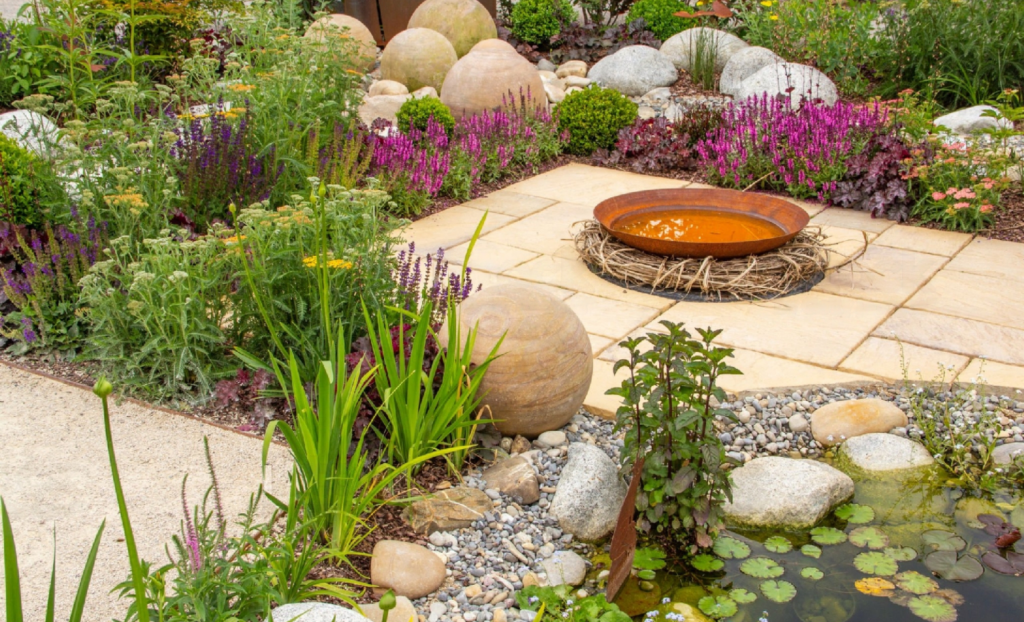 Low-maintenance rock garden with plants.